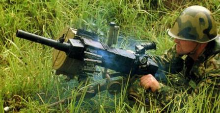 Russian soldier fires the AGS-30 grenade launcher.