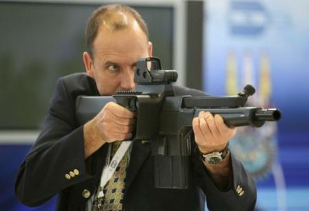 representative of DENEL Corp demonstrates PAW-20 weapon.