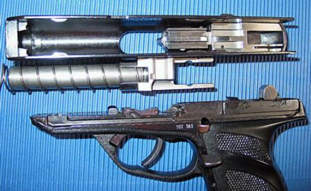 HK P9S partially disassembled. clearly seen are the barrel with its extension and cuts for rollers; and a separate two-part breechblock, inserted into the thin-walled slide.