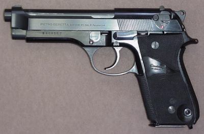 Beretta 92S - model with early style slide mounted safety and magazine release. Pachmayr grips.