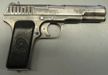 same pistol, right side view