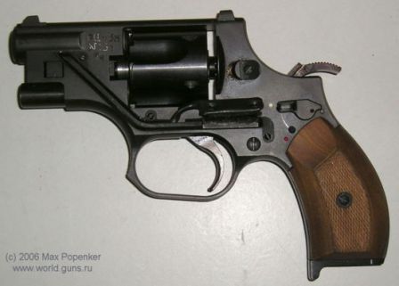 OTs-38 revolver, left side. Note that hammer is cocked and locked by manual safety. The button that controls built-in laser sight is visible above the trigger guard.