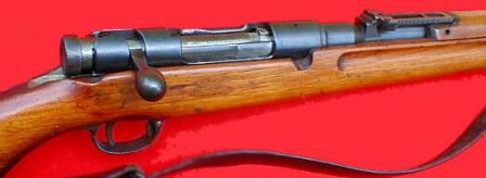 6.5mm Arisaka Type 38 rifle, close-up view on the receiver; bolt cover is removed.