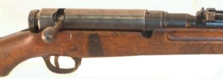 6.5mm Arisaka Type 38 rifle, close-up view on the receiver; bolt cover is installed.