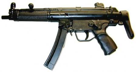 HK MP-5A3 with retractable buttstock. Earlier model with checkered handguard and a stamped steel S-E-F (in fact, S-1-A) trigger group.