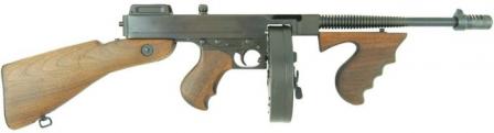 Thompson Model 1928 submachine gun with 50-round drum magazine and Cutts compensator.