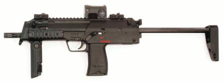 HK MP7A1 submachine gun / personal defense weapon in standard configuration,with shoulder stock and foregrip in firing position, and with collimating sightinstalled on top rail.